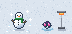 A big snowman on fresh snow beside a little one melting by a patio heater